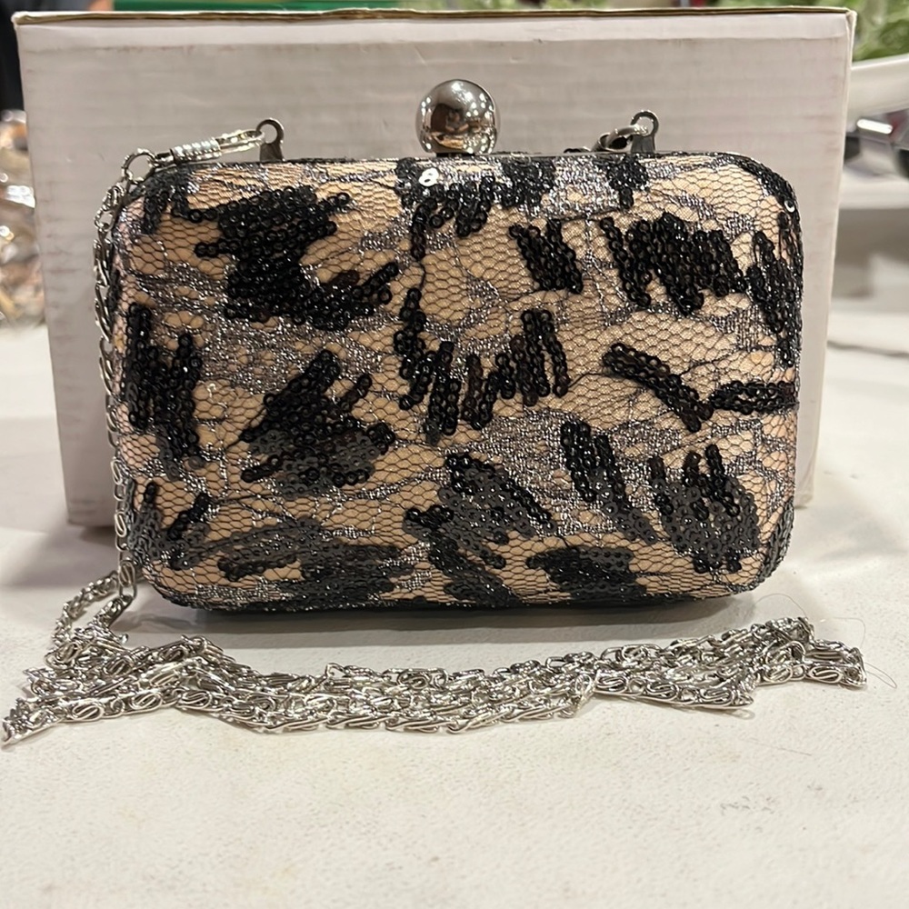 This adorable evening bag can be a clutch or a crossbody for a fancy night out